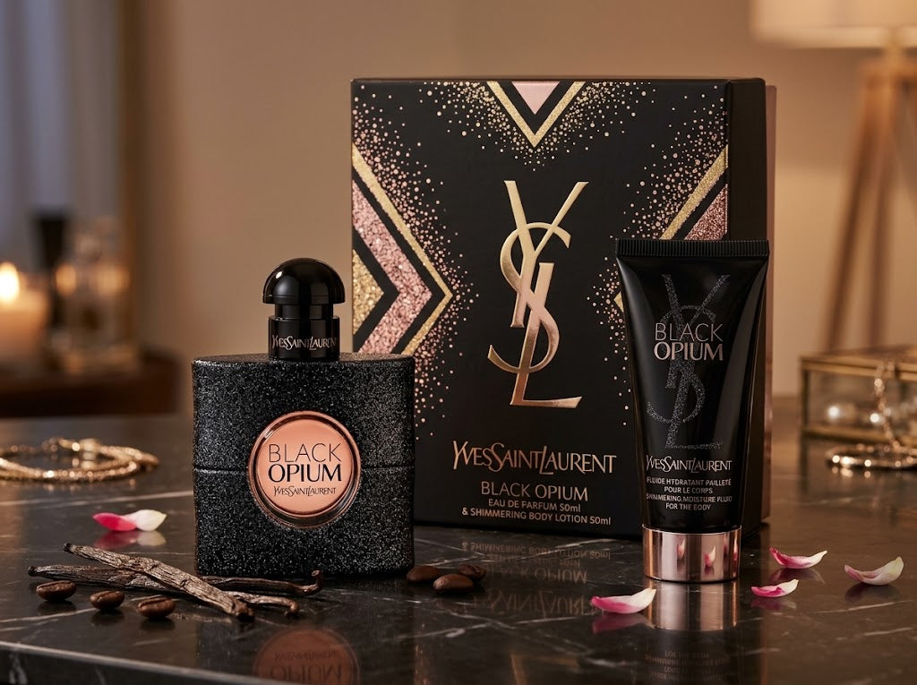 Yves Saint Laurent Black Opium Gift Set with a 50ml glittery Eau De Parfum bottle, 50ml Shimmering Body Lotion, and a black-and-gold YSL gift box on a dark marble vanity